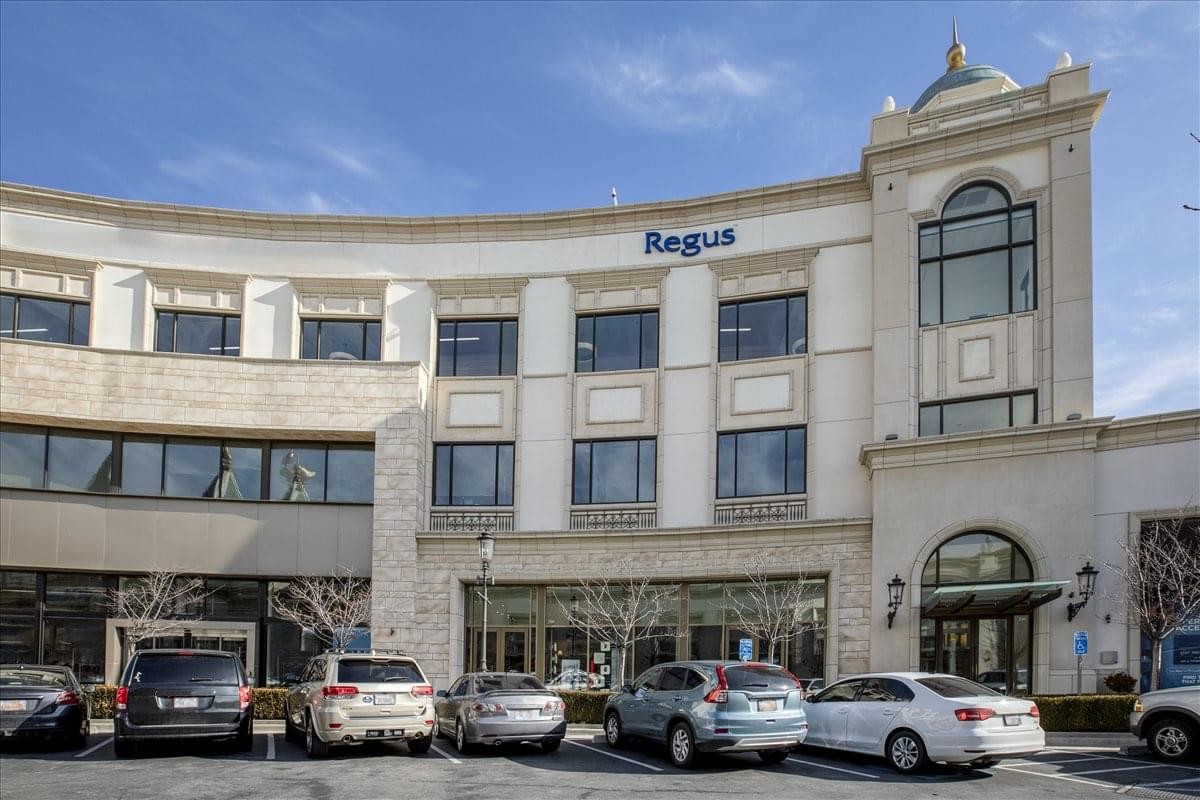 Exterior view of the classic stone facade building at Station Park, Suite C-200.