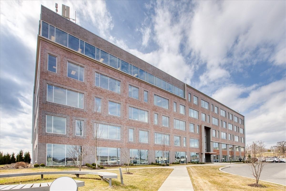 Exterior view of the multi-story brick facade at 2400 Zenith Ridge Drive.