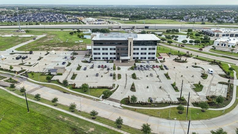 Aerial view of the multi-story office building at Via Mazzini Way, Richmond, Texas.
