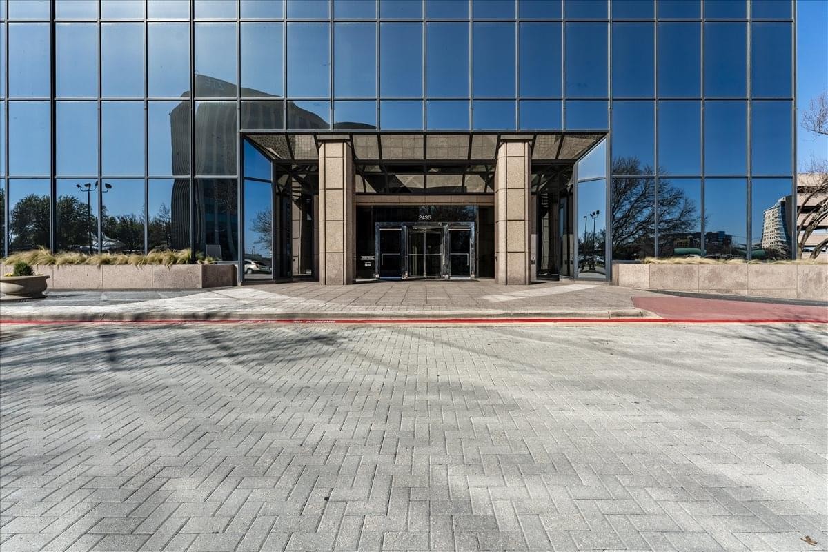 Main entrance and glass facade of Richardson Telecom at 2435 North Central Expressway.