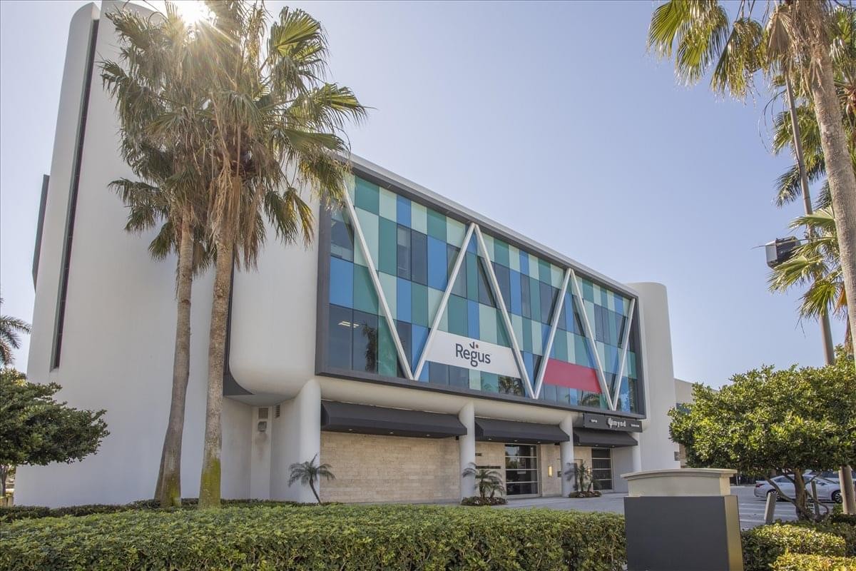 Exterior facade of the Galleria building at 2598 East Sunrise Boulevard with palm trees.
