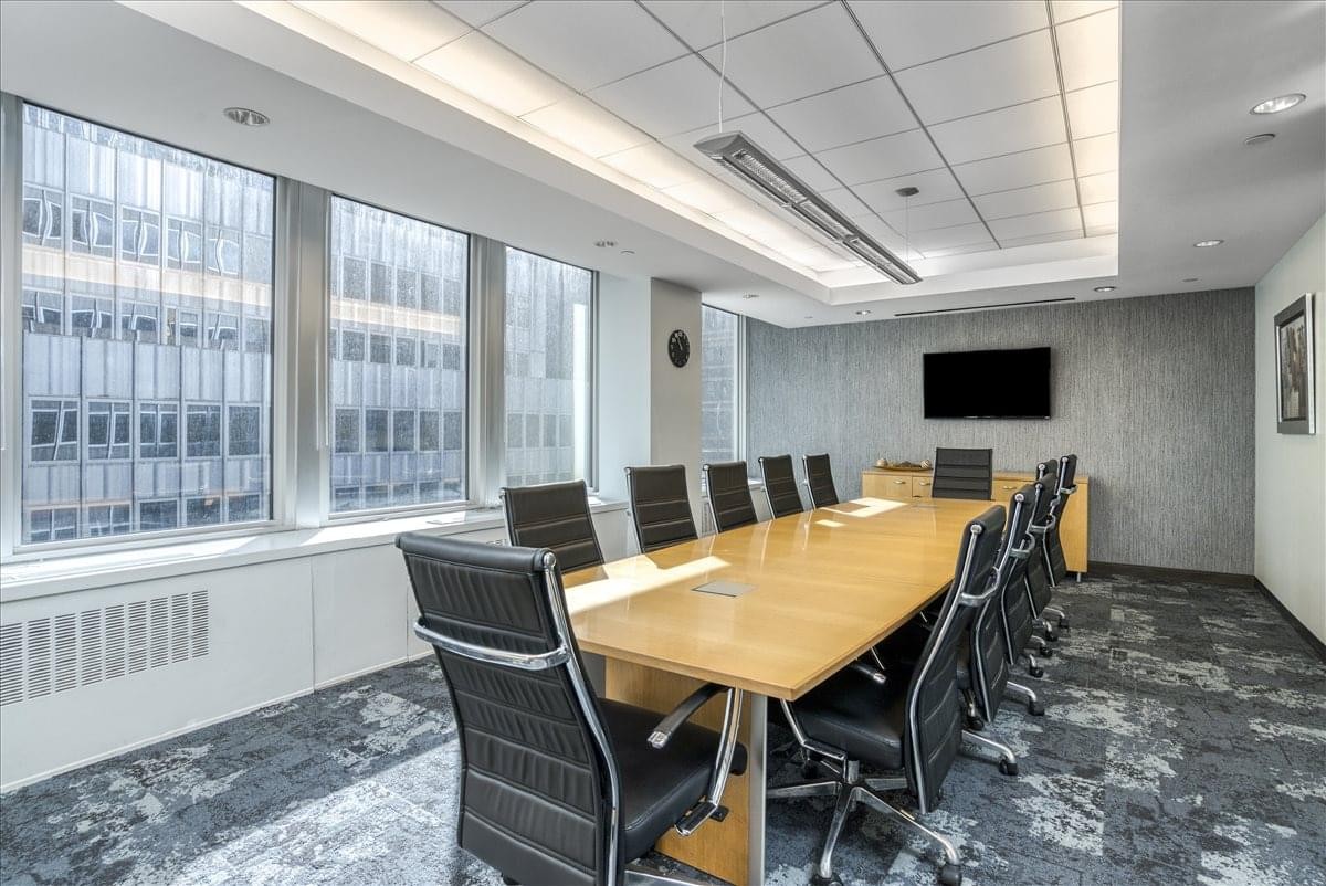 Long formal boardroom with large windows and city views at 260 Madison Avenue, Midtown, New York.