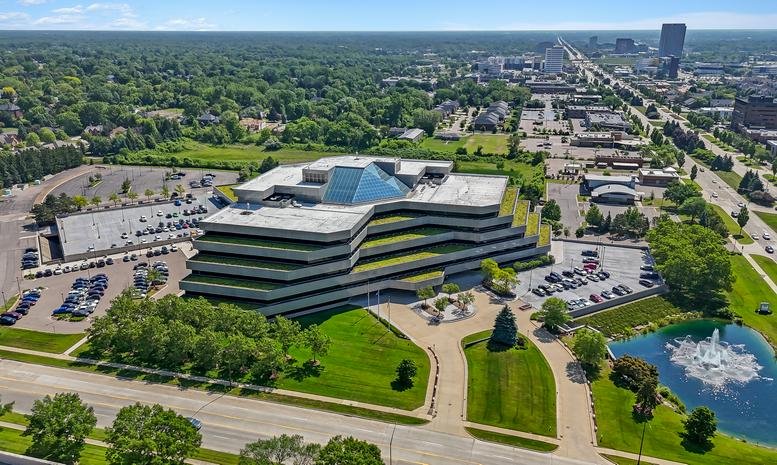 Aerial exterior view of the tiered glass and concrete building at AWWC, Suite 500, 2600 W Big Beaver Road.