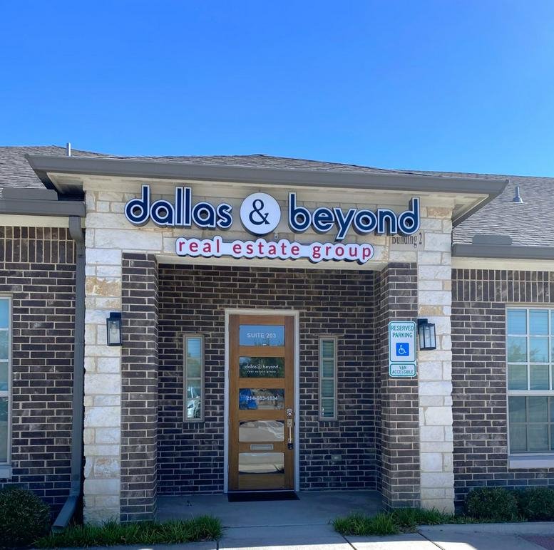 Exterior view of the brick entrance for Dallas & Beyond Real Estate Group at 2681 MacArthur Boulevard.