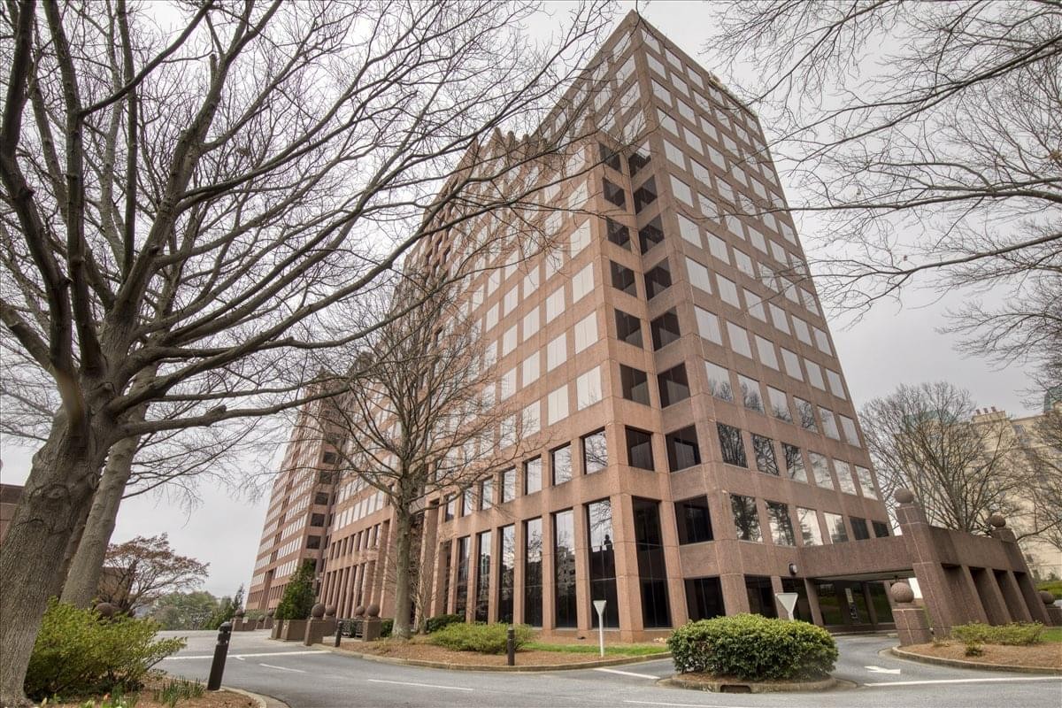 Exterior view of the multi-story brick facade at 2727 Paces Ferry Road, Suite 750.