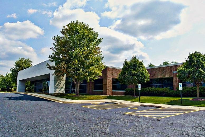 Exterior view of the brick and glass building at 27475 Ferry Road.
