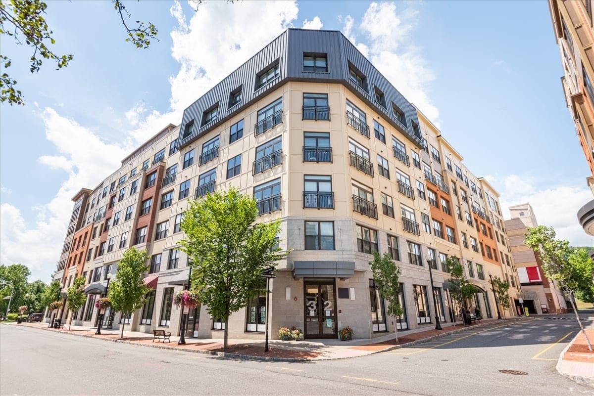 Exterior view of the modern multi-story brick and stone building at 28 Valley Road, Suite 1.