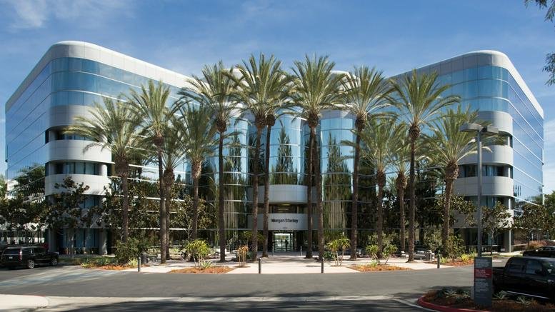 Exterior view of the contemporary glass-fronted building at 28202 Cabot Road, Suite 300.