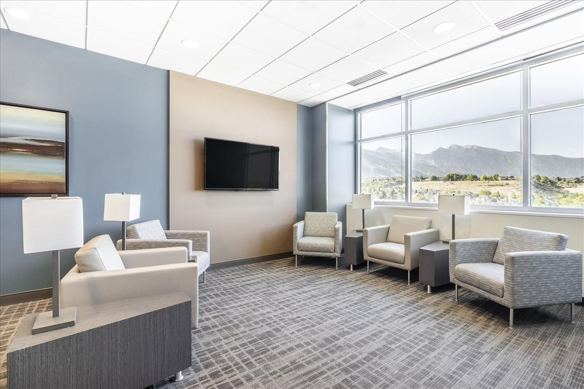 Contemporary lounge area at 2825 East Cottonwood Parkway, Suite 500 with armchairs and mountain views.
