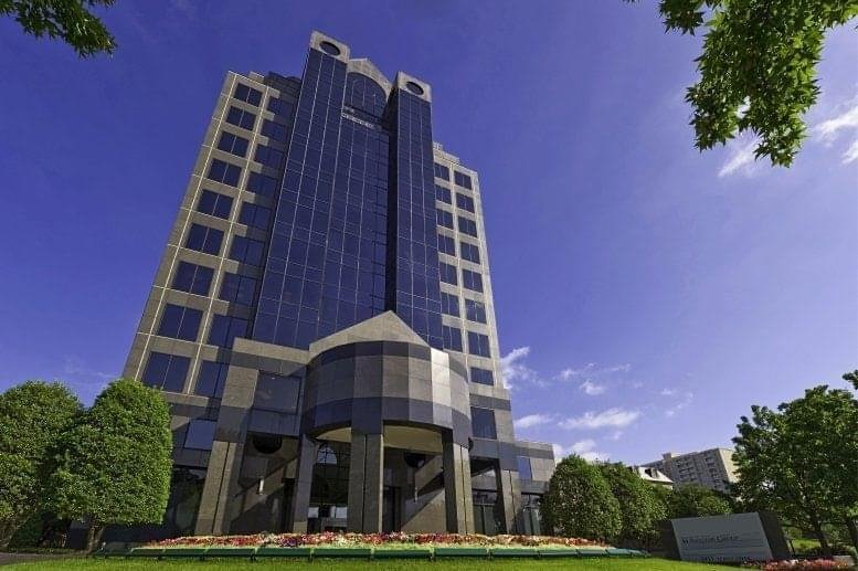 Exterior view of the Turtle Creek Center building facade under a clear blue sky.