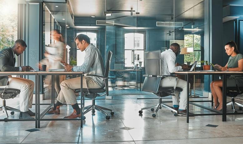 Spacious open-plan workspace at 3 Park Street, Sydney, Nova Scotia, Canada with glass walls and professional desks.