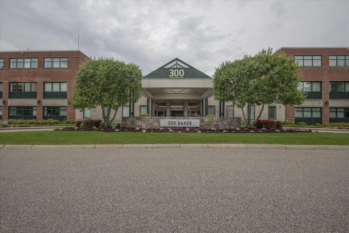Exterior view of the brick facade and main entrance at 300 Baker Avenue.