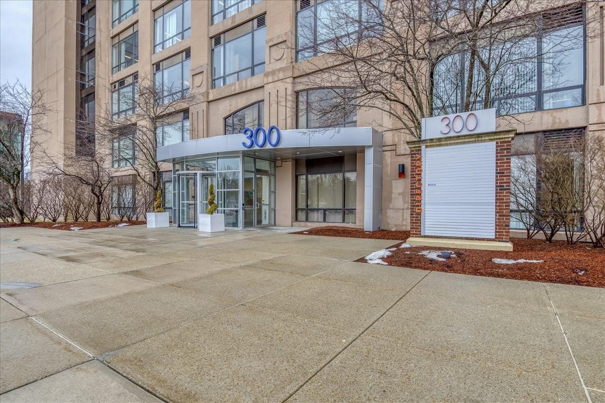 Exterior view of the modern brick facade and glass entrance at 300 Brickstone Square, Suite 201.