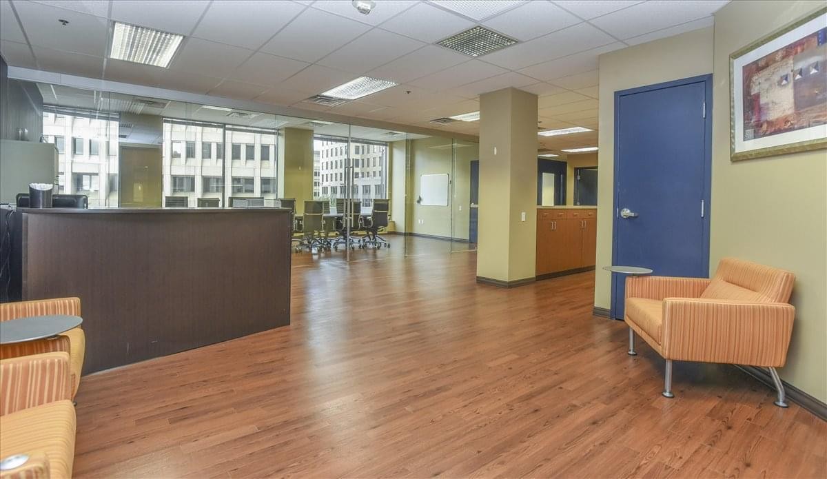 Spacious reception area with wood floors at 300 Delaware Avenue, Suite 210.
