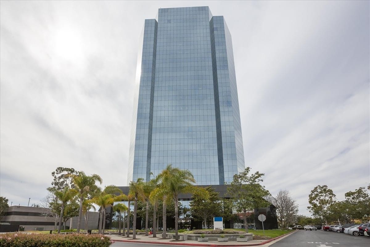 Exterior view of the glass-facade skyscraper at 300 East Esplanade Drive.