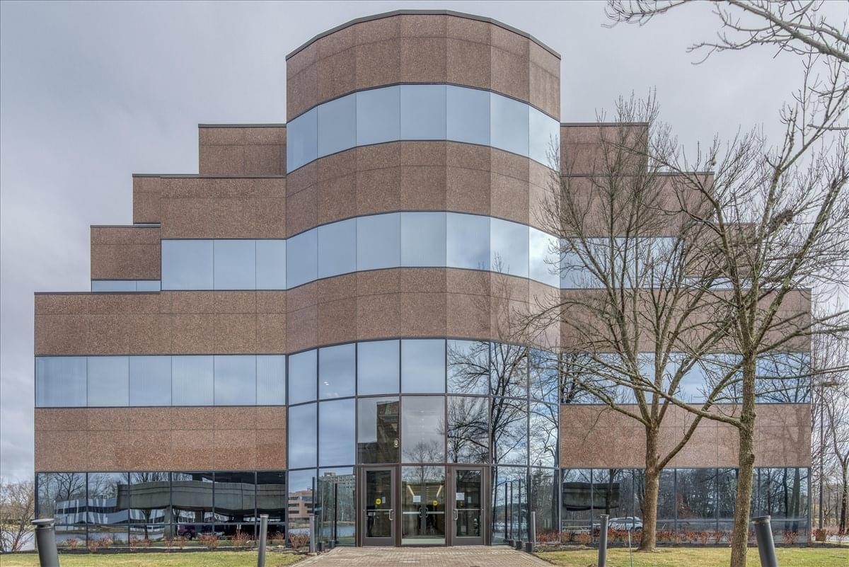 Exterior view of the tiered brick and glass building at 301 Edgewater Place.