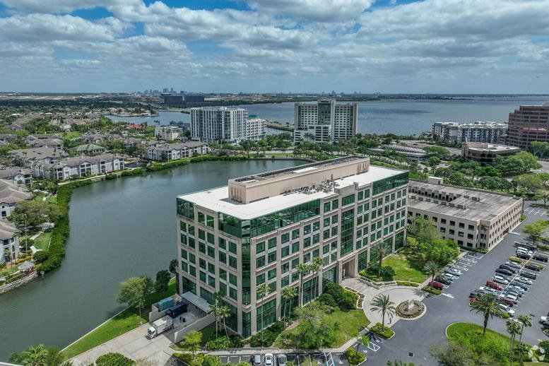Aerial view of Harborview Plaza overlooking a scenic lake and Tampa Bay.