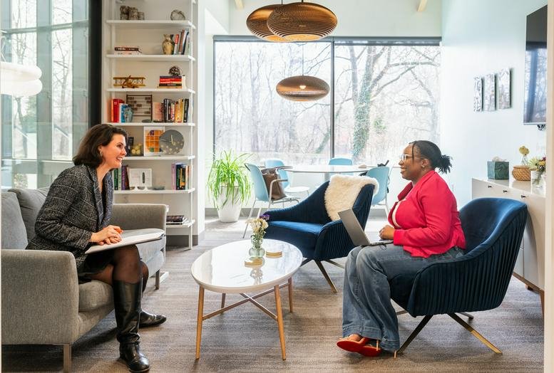 Bright coworking lounge at HAYVN, 320 Boston Post Road, Darien, Connecticut with mid-century modern furniture.