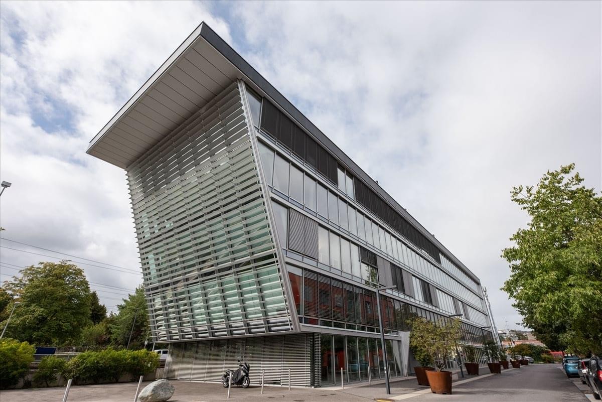 Exterior view of the glass and metal facade at 320 Seven Springs Way.