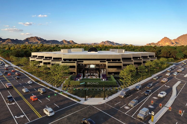 Exterior aerial view of the modern Phoenix Bond office building surrounded by desert mountains.