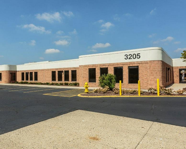 Exterior brick facade and main entrance of 3205-3231 North Wilke Road, Antioch (Illinois).