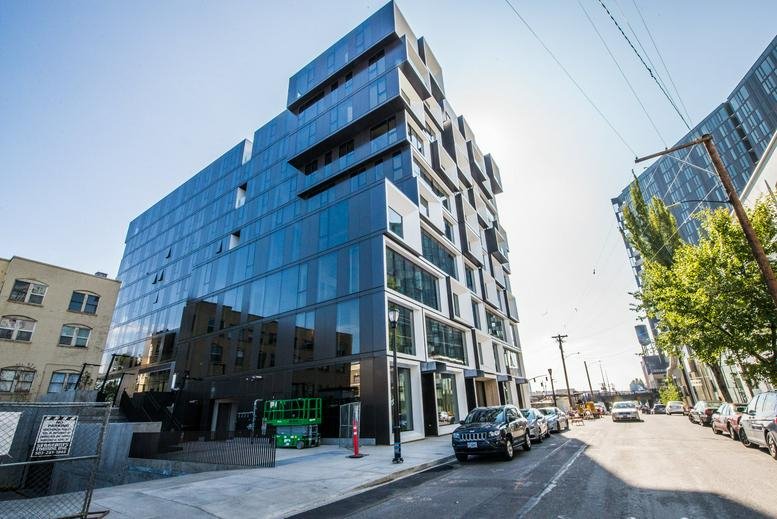 Exterior view of the modern geometric glass facade at 329 NE Couch Street, Portland (Oregon).