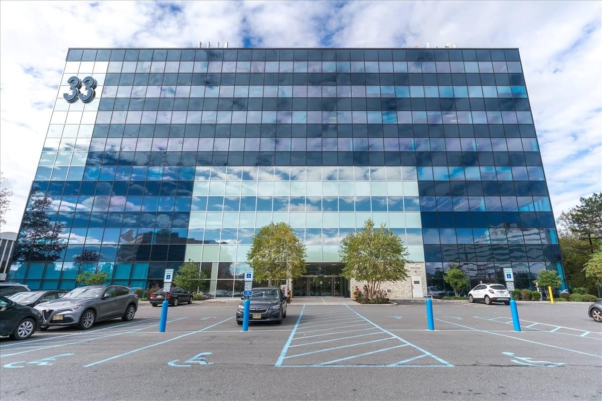 Exterior view of the glass-facade 33 Wood Avenue South building at Metropark Center.
