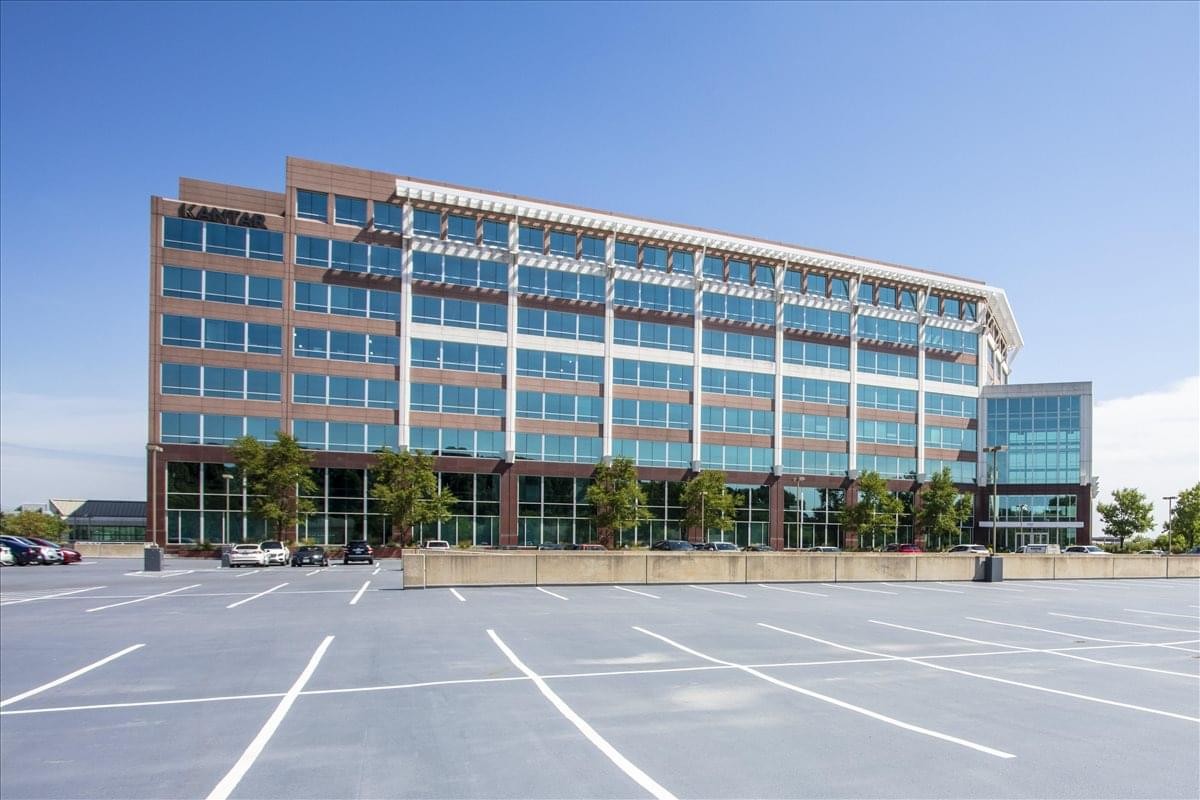 Exterior view of the multi-story glass and brick facade of Central Park of Lisle Centre.