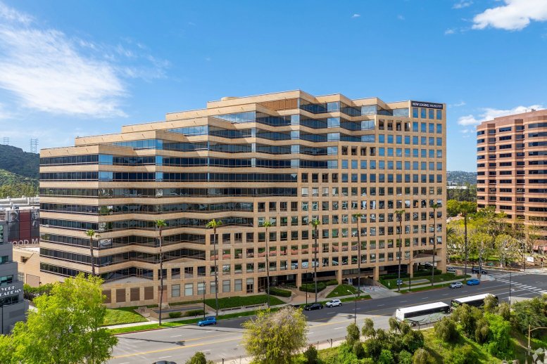 Exterior view of the tiered glass and stone building at 3400 Riverside Drive.