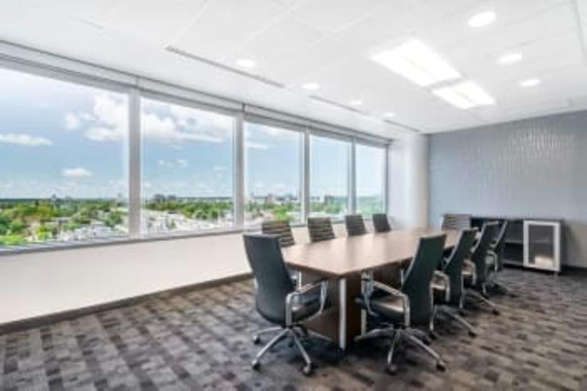 Bright boardroom at 343 Preston Street with floor-to-ceiling windows and scenic views.