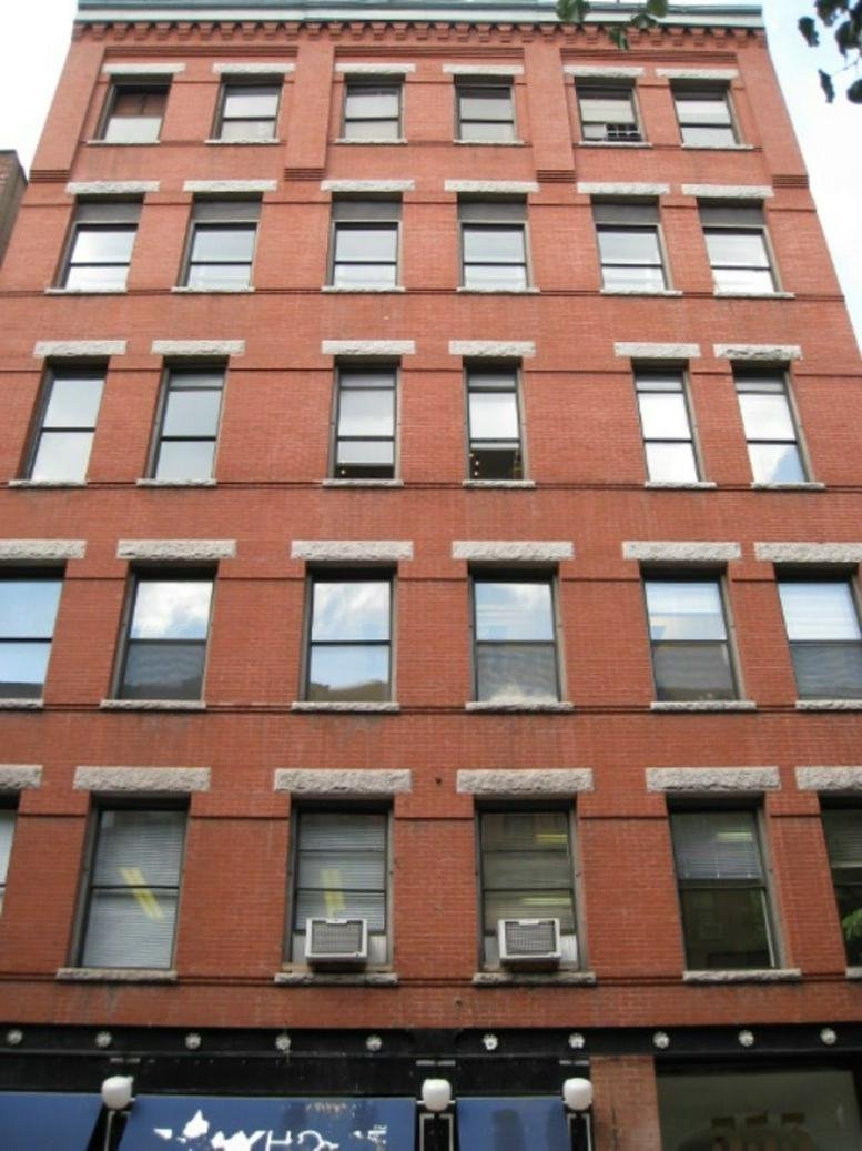 Exterior view of the red brick building at 353 West 48th Street.