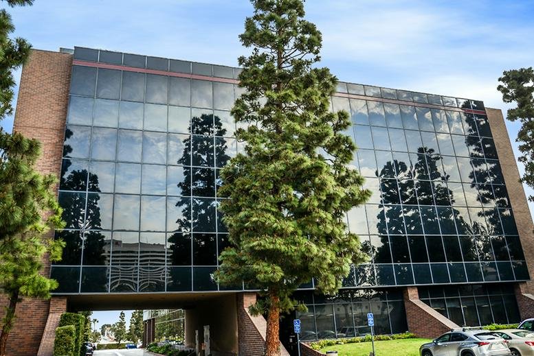 Exterior view of the glass-facade building at 3655 Torrance Blvd.