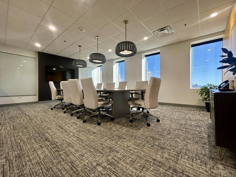 Spacious boardroom with a large table and city views at 3838 North Central Avenue, Suite 900.