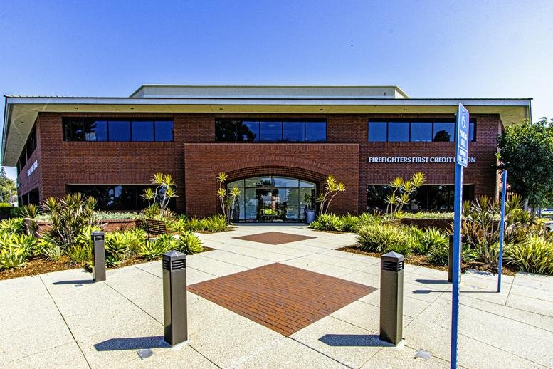 Exterior view of the brick facade at 4000 Barranca Parkway, Suite 250, Centerstone Plaza.
