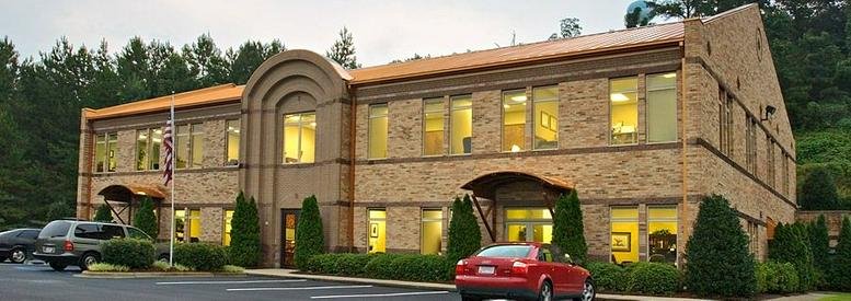 Exterior view of the brick facade at 4000 Eagle Point Corporate Dr. in the Eagle Point Office Park.