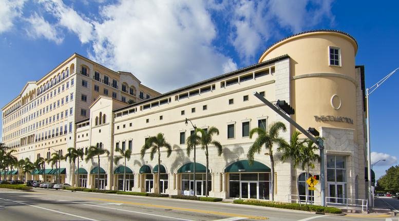 Exterior view of the Mediterranean-style building facade at 4000 Ponce de Leon Boulevard.