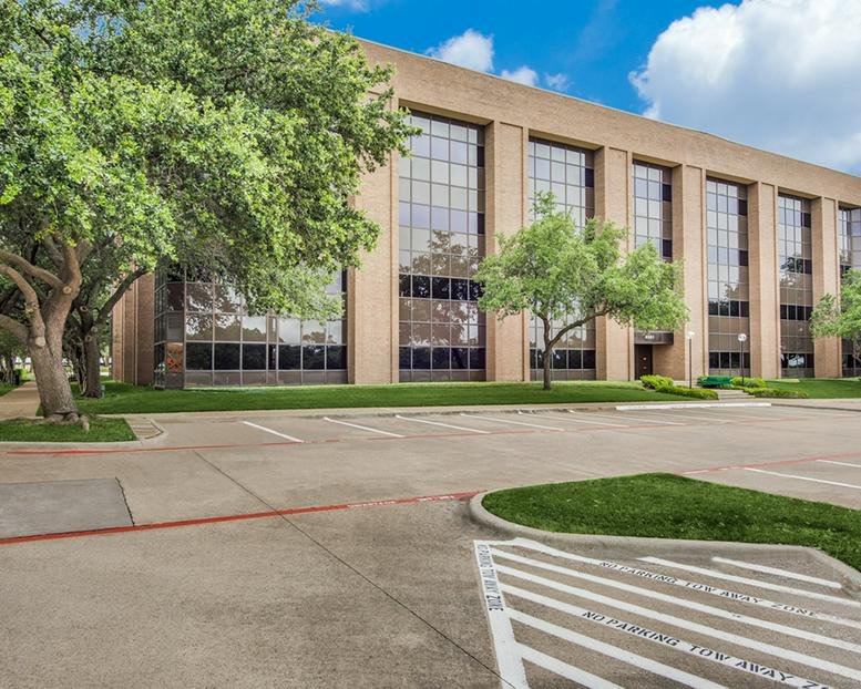 Exterior view of the brick and glass facade building at 4001 McEwen.