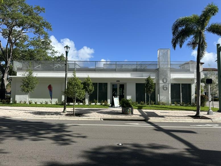 Exterior view of the white modern building at 406 Lucerne Avenue.