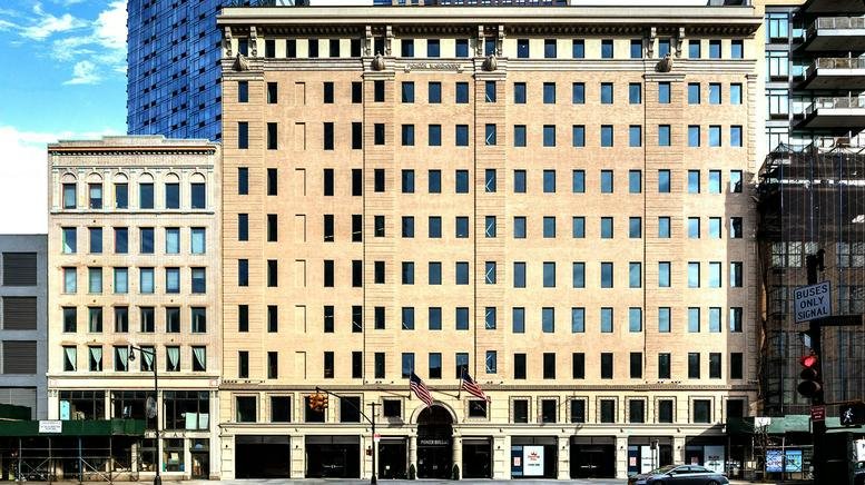 Classic stone facade and arched entrance of the Pioneer Building.