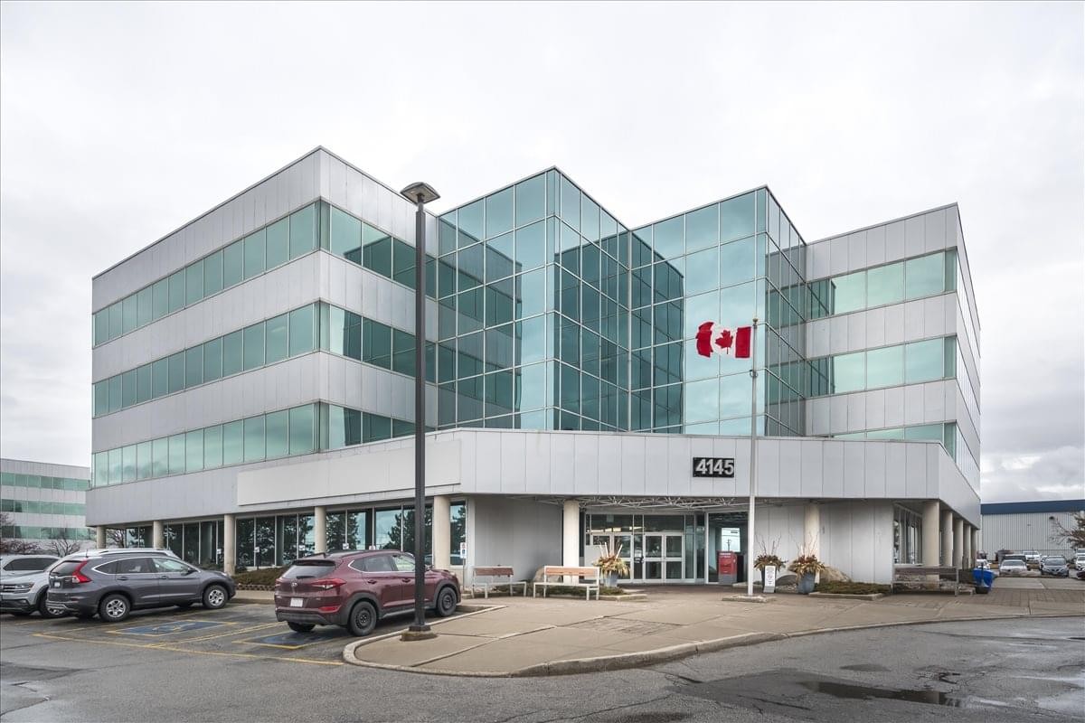 Exterior view of the glass and stone facade at 4145 North Service Road, Burlington Center.