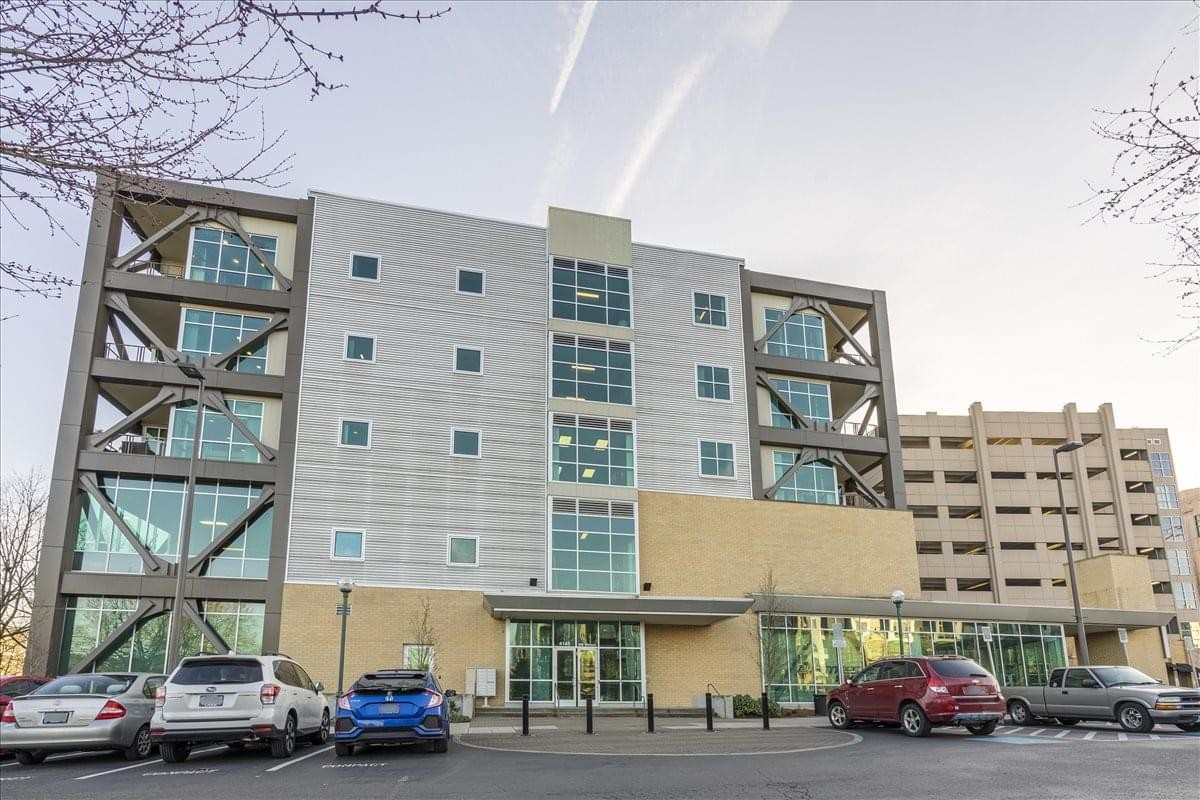 Modern exterior of the Beaverton Round building at 4145 S. W. Watson with a glass and metal facade.
