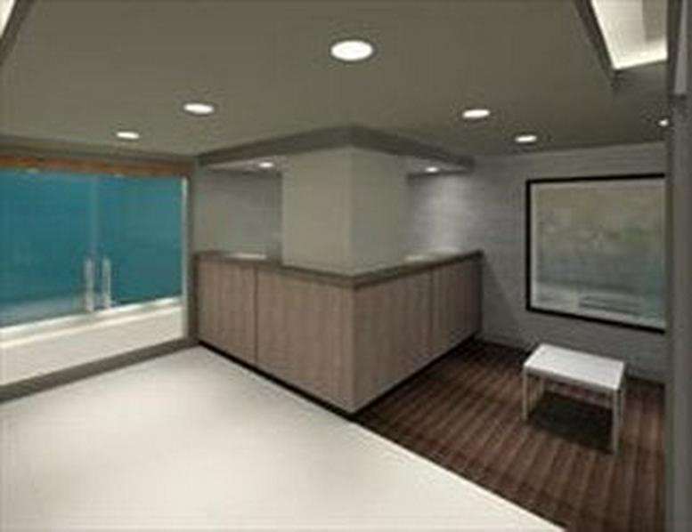 Reception area featuring a wood-paneled desk and striped carpet.