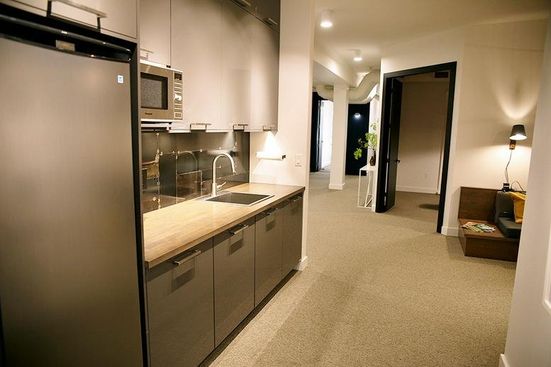 Spacious communal kitchen and hallway at 420 George Street, Peterborough (Ontario).