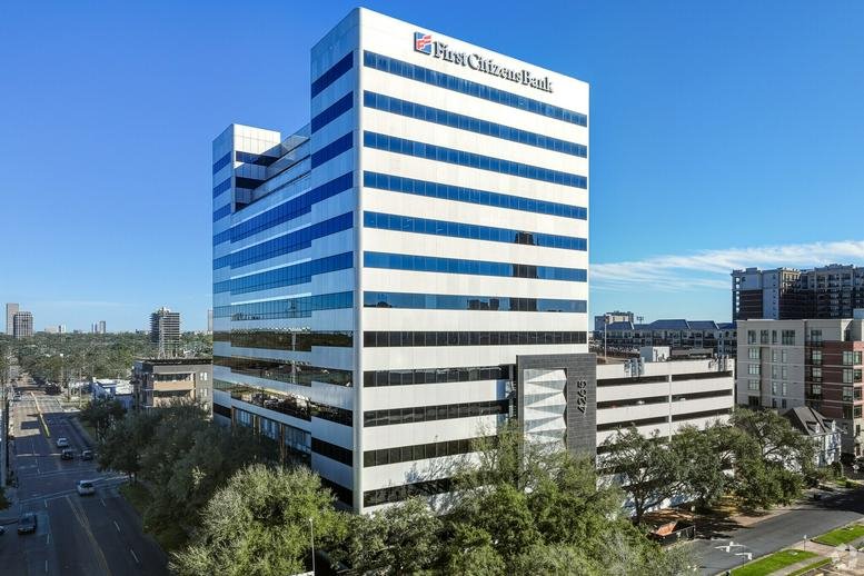Exterior view of the glass-facade Anchor Office building at 4265 San Felipe Street.