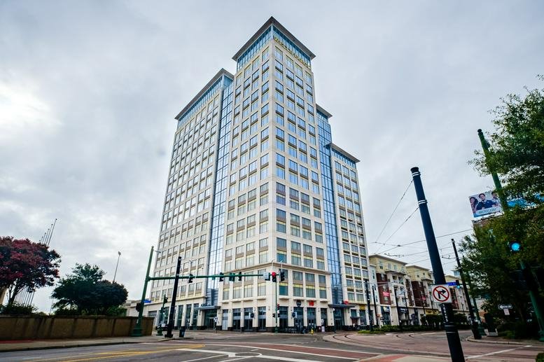 Exterior view of the multi-story Wells Fargo Building, Monticello Avenue, Norfolk under a cloudy sky.