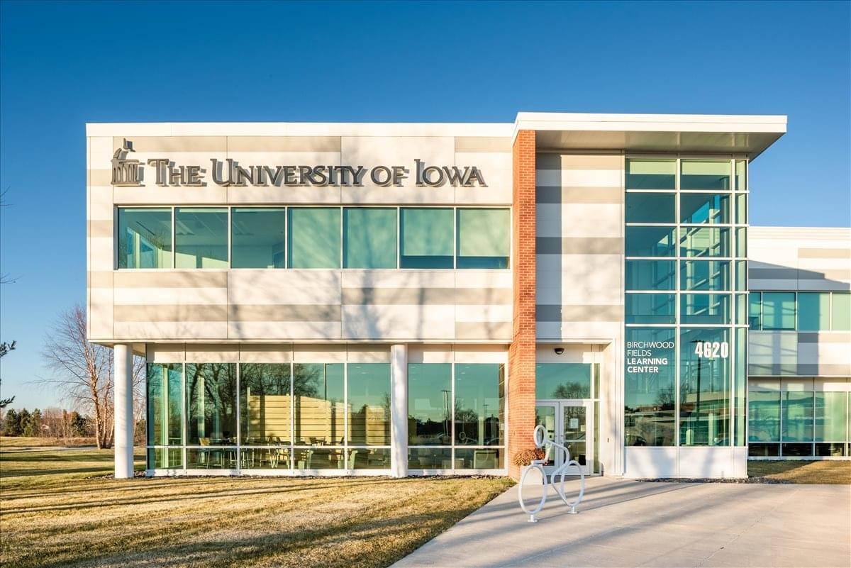 Exterior view of the Birchwood Business Centre featuring glass windows and stone facade.