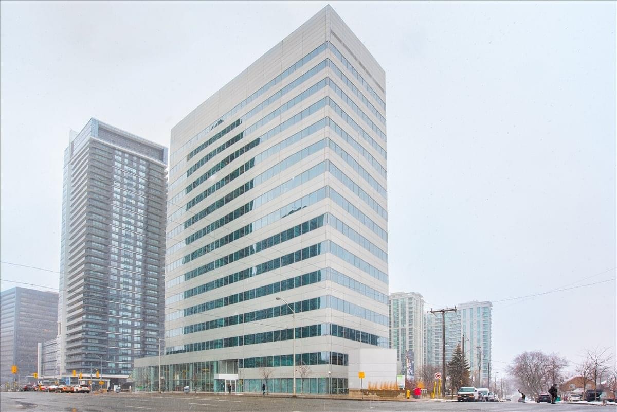 Exterior view of the white high-rise glass tower at 4711 Yonge Street.
