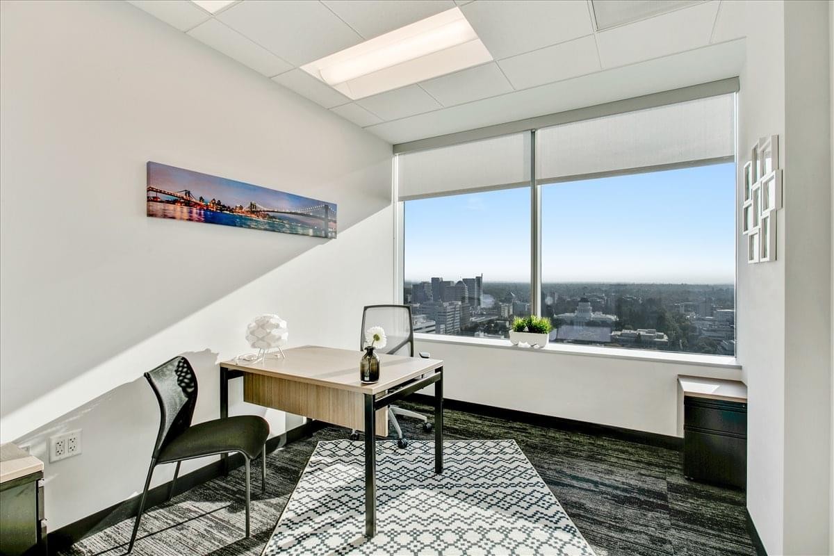 Private corner office at 500 Capitol Mall, Suite 2350, featuring floor-to-ceiling city views.