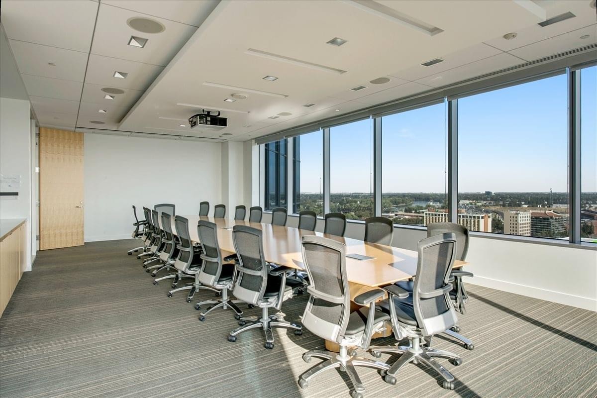 Professional boardroom at 500 Capitol Mall, Suite 2350 with city views and glass walls.