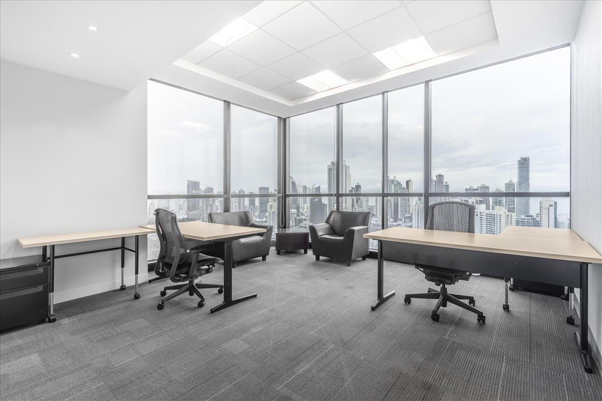 Spacious corner office at Tower Financial Center with floor-to-ceiling windows and city skyline views.